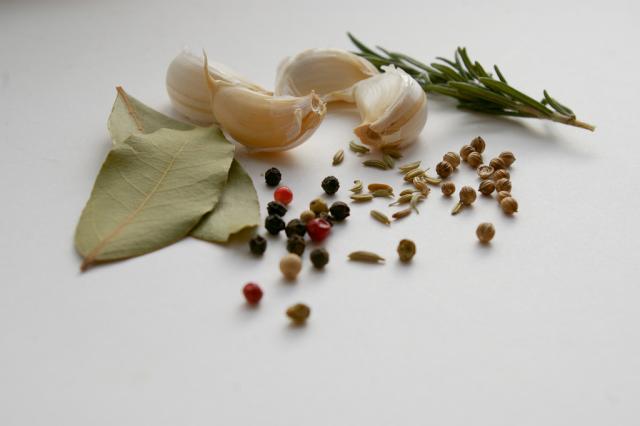 Herbs and spices laid out on a surface