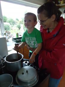 Mother and child making soup