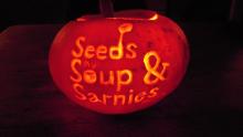 Pumpkin carved with the words Seeds, Soup and Sarnies